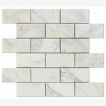 Load image into Gallery viewer, Calacatta Gold 2x4 Beveled Marble Mosaic
