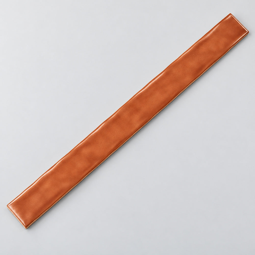 Ambrya copper 2x20 glossy ceramic tile — angled full tile view