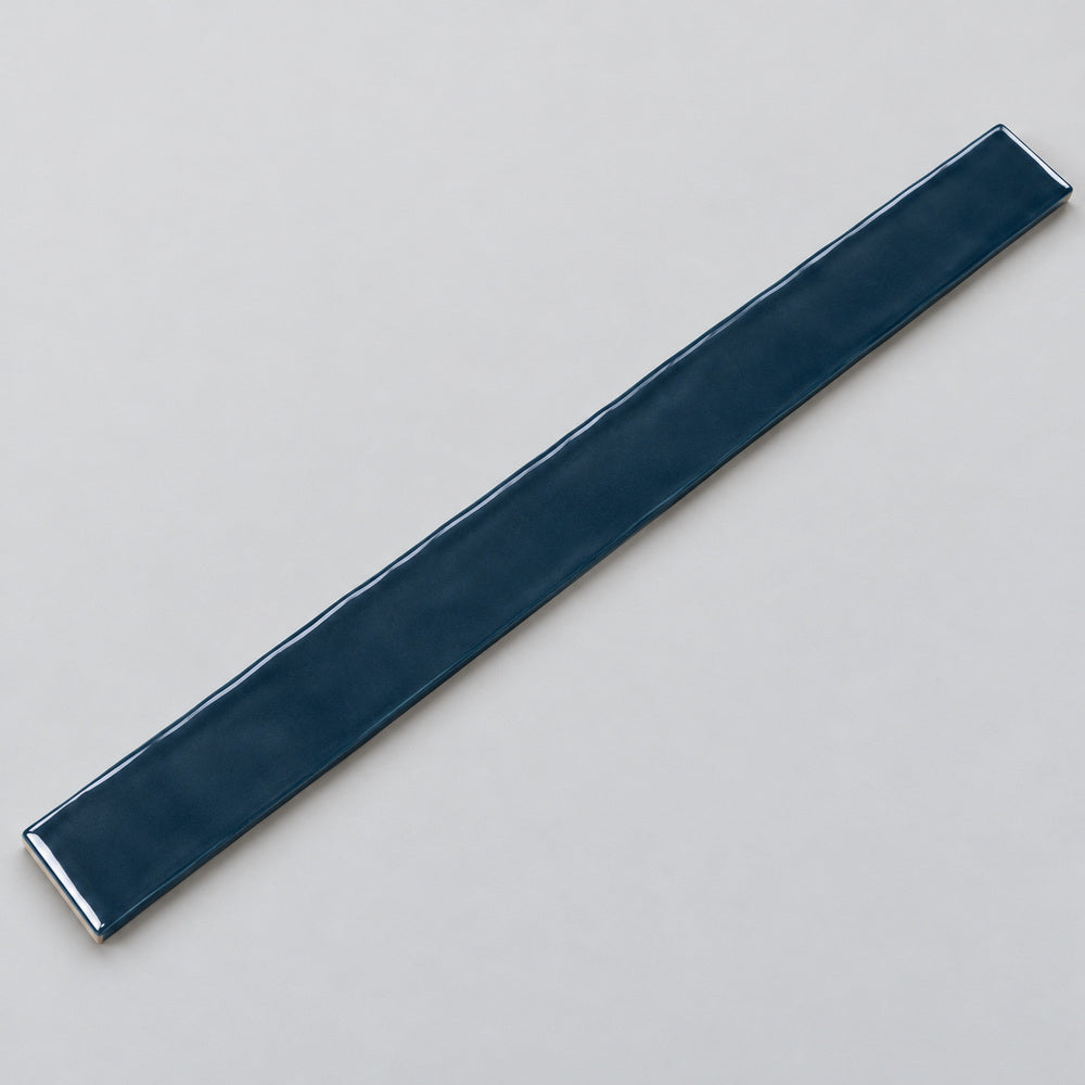 Ambrya sapphire 2x20 glossy ceramic tile — angled full tile view