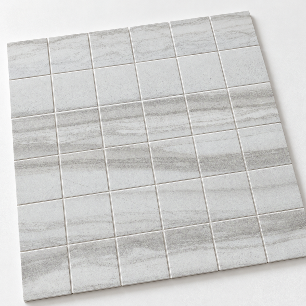 Flamen Blanco 2x2 matte porcelain mosaic sheet detail — AI-generated visualization; see original supplier image for reference.