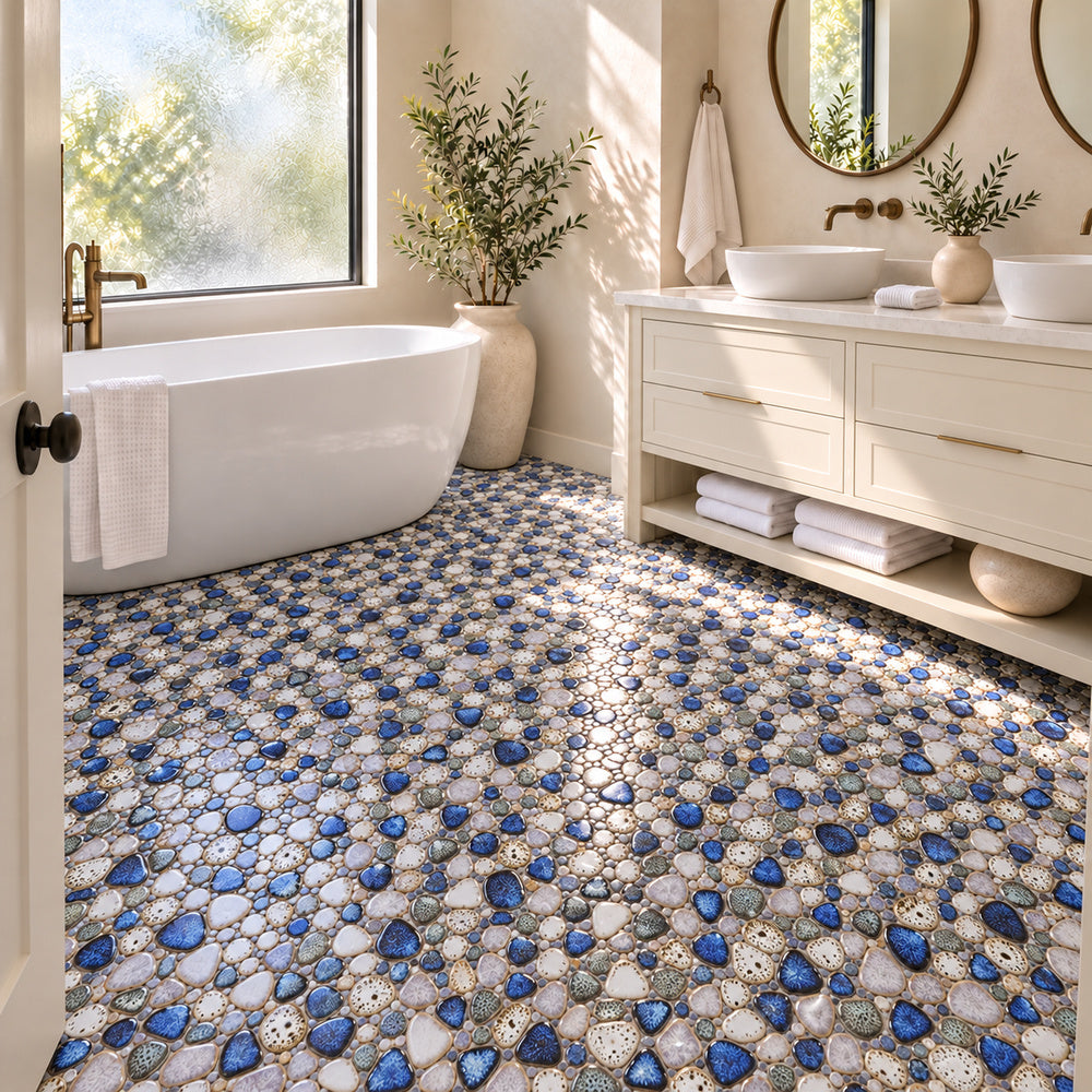 Nevis Pearl Blue Pebble Mosaic installed on a bathroom floor, small irregular reactive-glaze mosaic chips