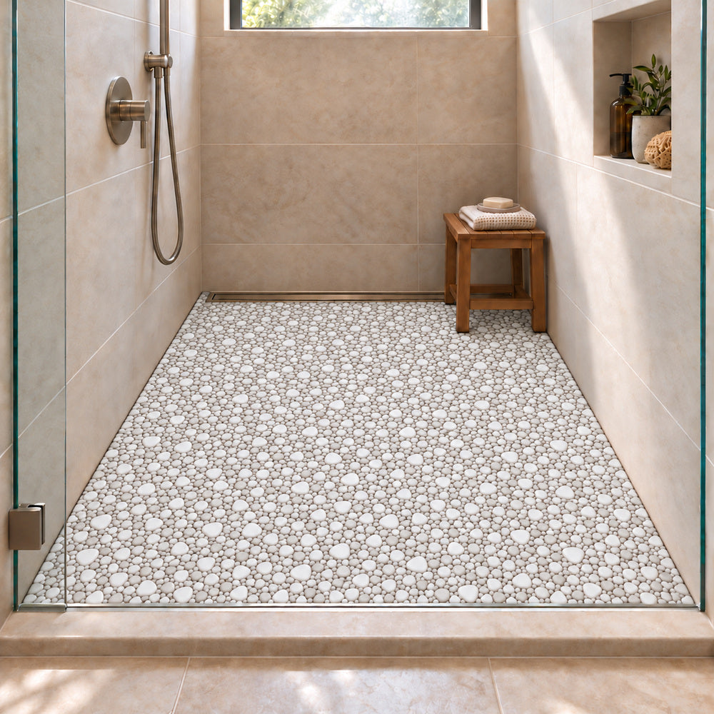 Nevis Whisper White Pebble Mosaic installed with small irregular porcelain chips on shower floor