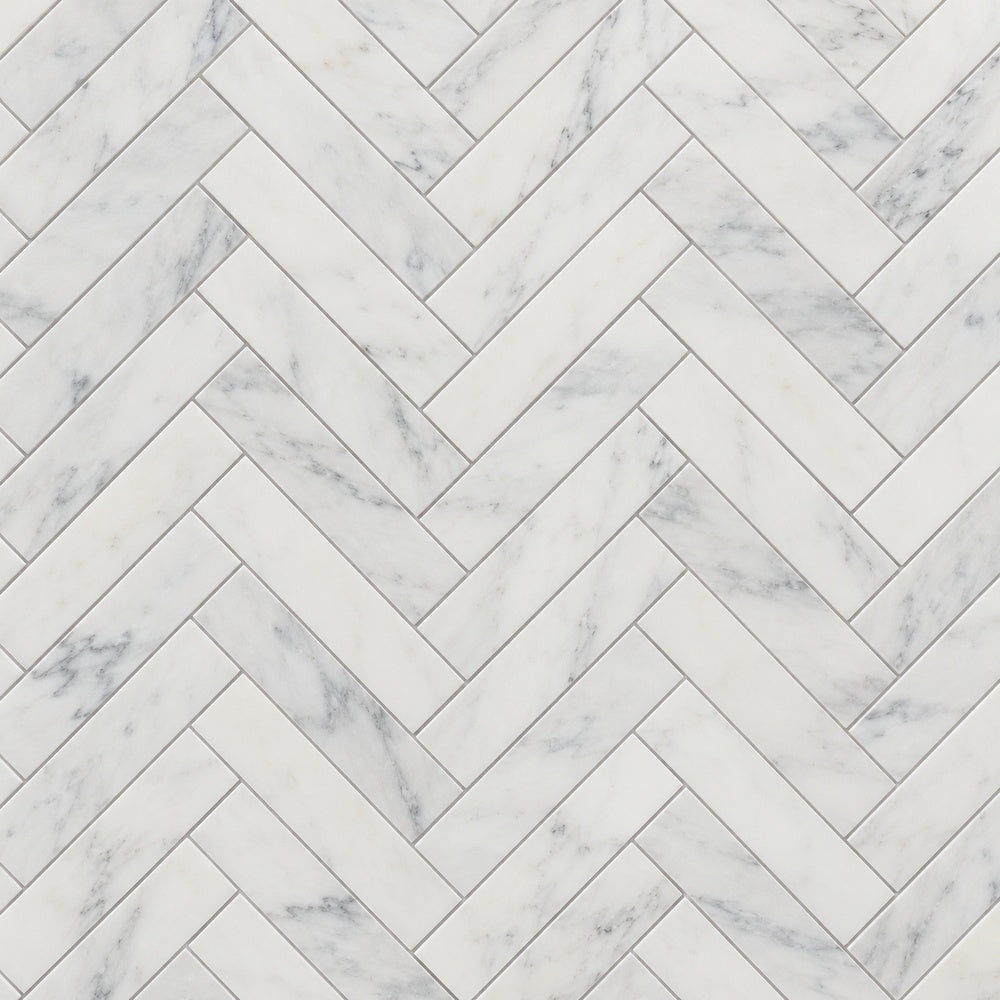 Calacatta Prestige 1x4 herringbone installed marble close-up