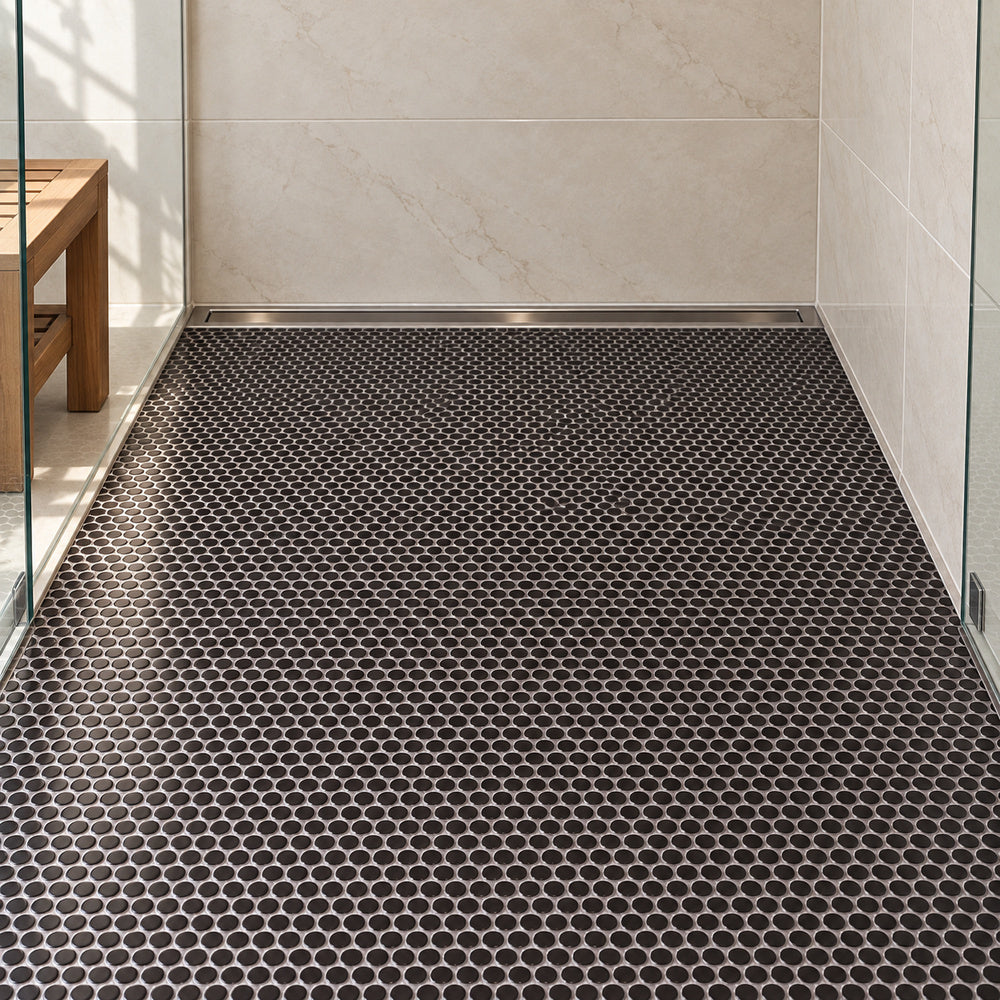 Simple Black Penny Round Ceramic Mosaic installed with straight aligned penny-round mosaic sheets on shower floor