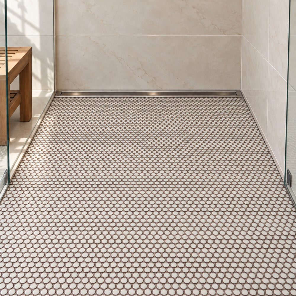 Simple Cream Penny Round Ceramic Mosaic Glossy installed in straight sheets on shower floor