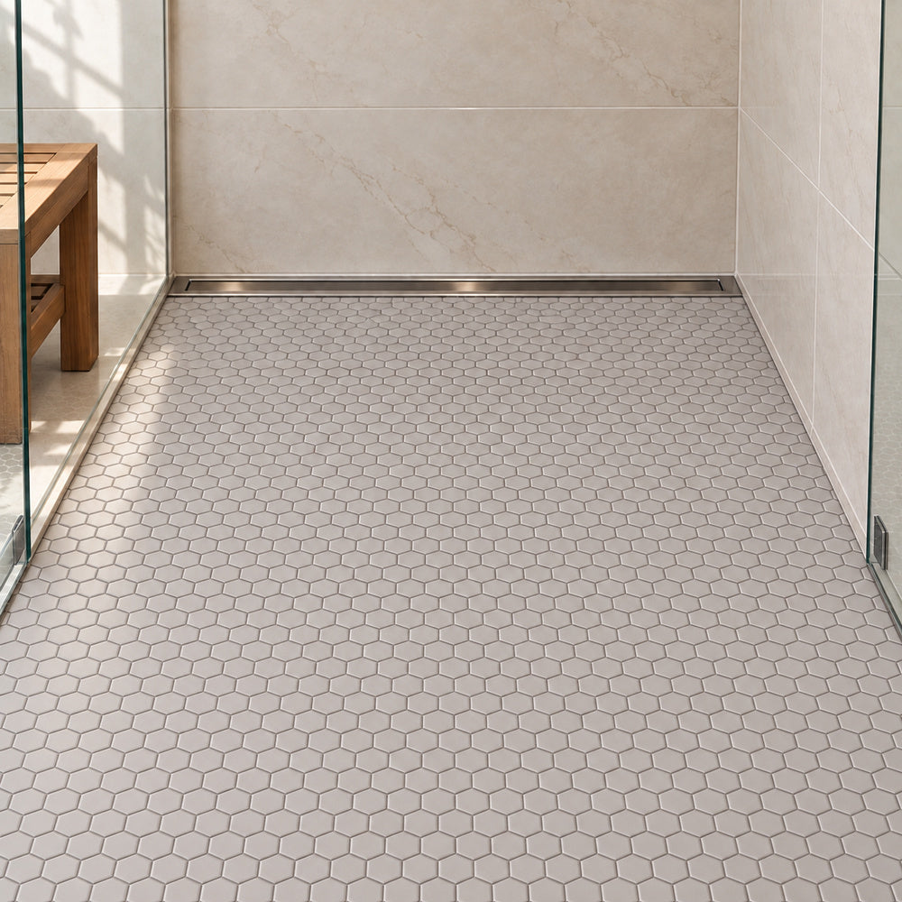 Simple Gray 1" Hexagon Ceramic Mosaic Matte installed on shower floor with aligned mosaic sheets