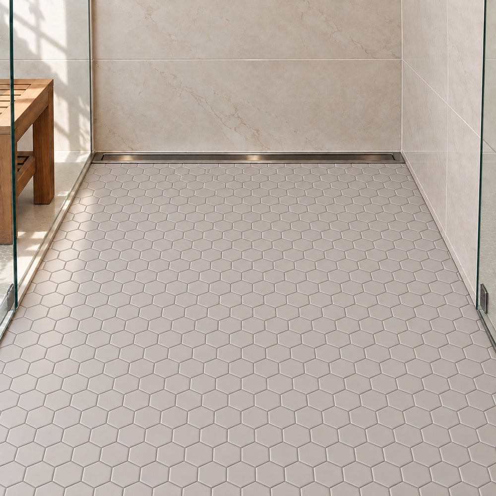 Simple Gray 2" Hexagon Ceramic Mosaic Matte installed on shower floor with aligned mosaic sheets