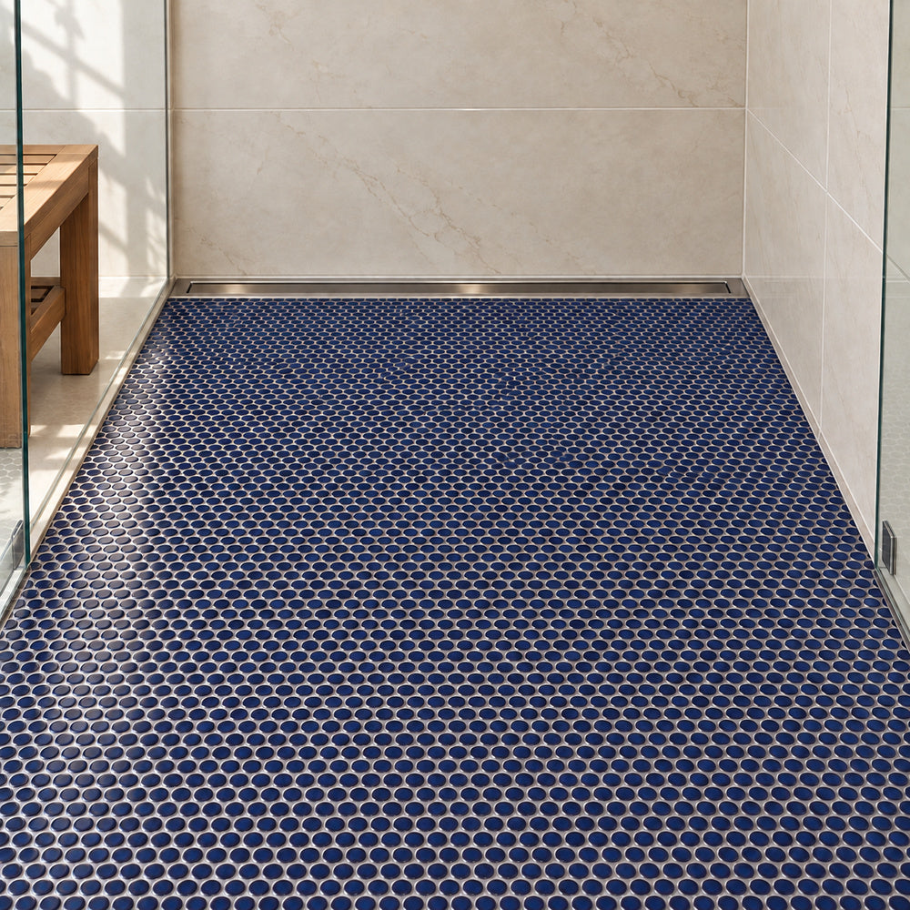 Simple Navy Blue Penny Round Ceramic Mosaic Glossy installed with straight aligned penny-round mosaic sheets on shower floor