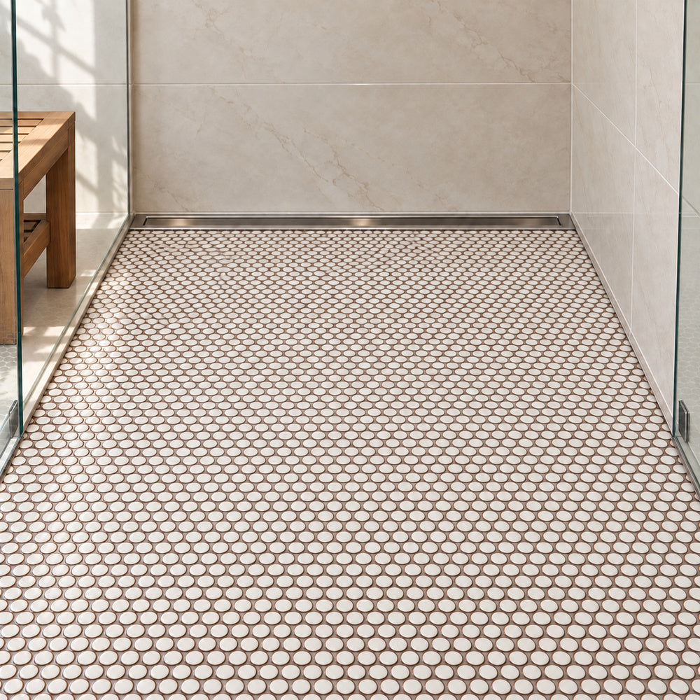 Simple Pearl White Penny Round Ceramic Mosaic Glossy installed in straight sheets on shower floor