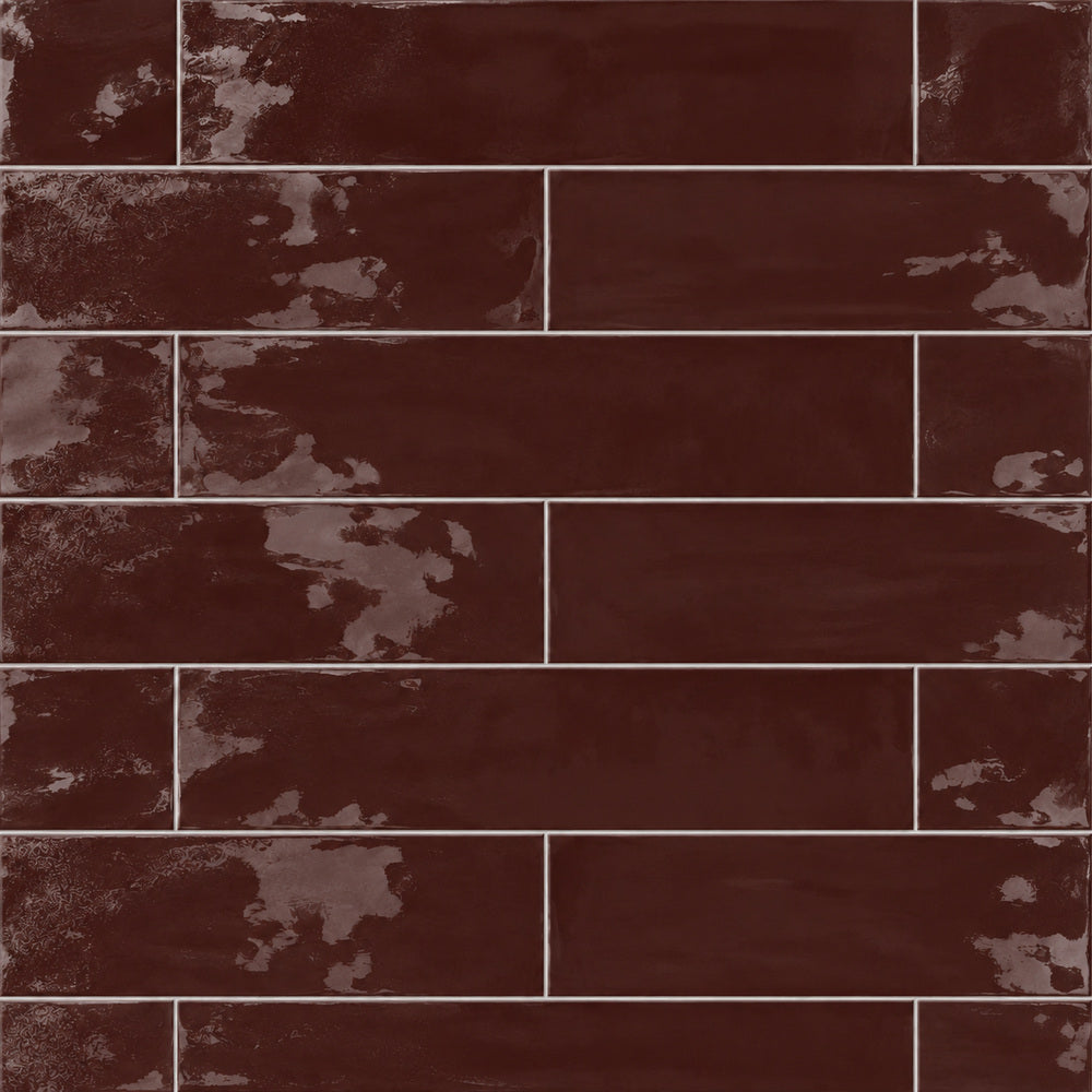 Solenne burgundy 2x9 glossy porcelain tile close-up, half-offset rectangular layout