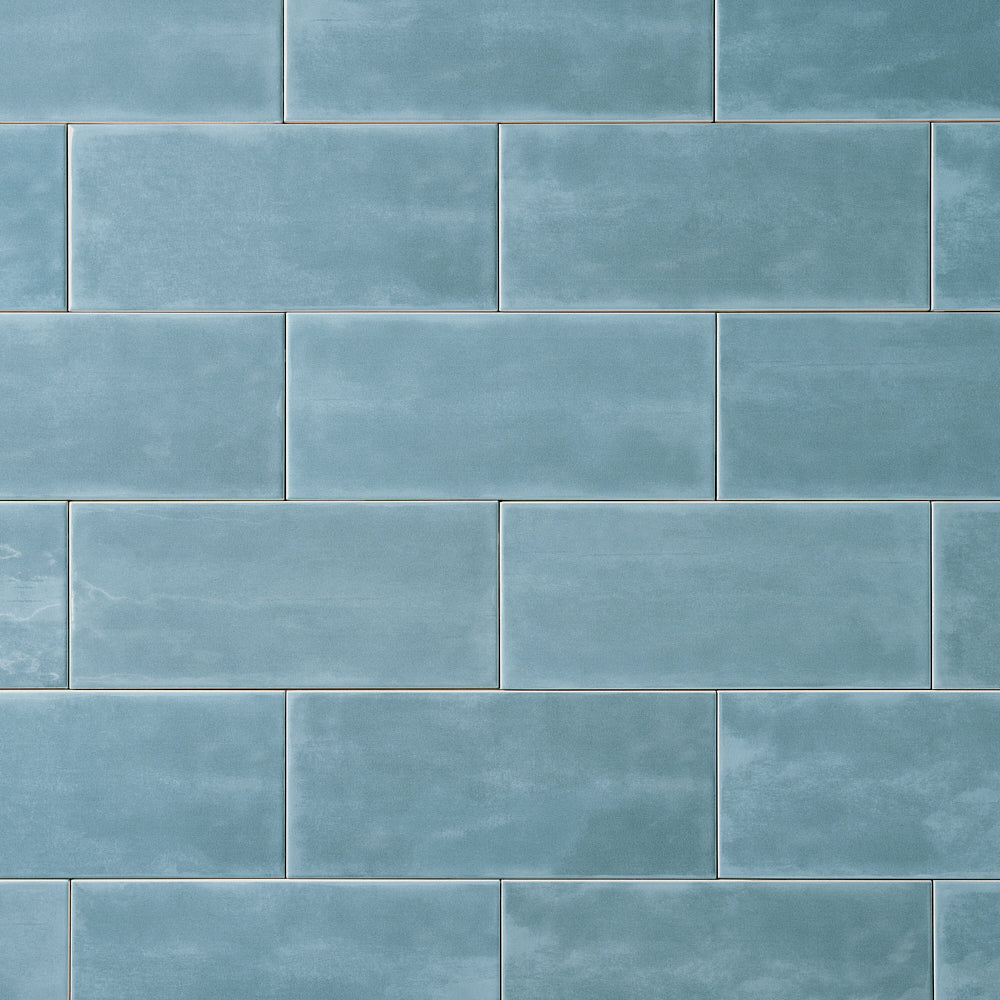 San Fran Volga Blue 4x10 Ceramic Tile Glossy — installed close-up